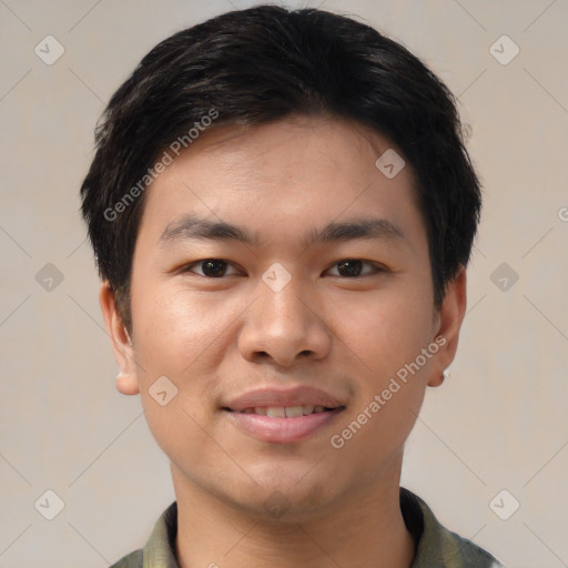 Joyful asian young-adult male with short  black hair and brown eyes