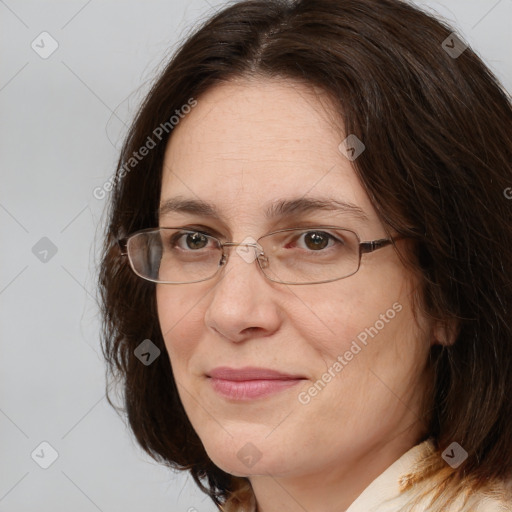 Joyful white adult female with medium  brown hair and brown eyes