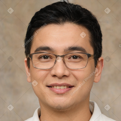 Joyful white young-adult male with short  black hair and brown eyes