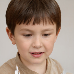 Joyful white child male with short  brown hair and brown eyes