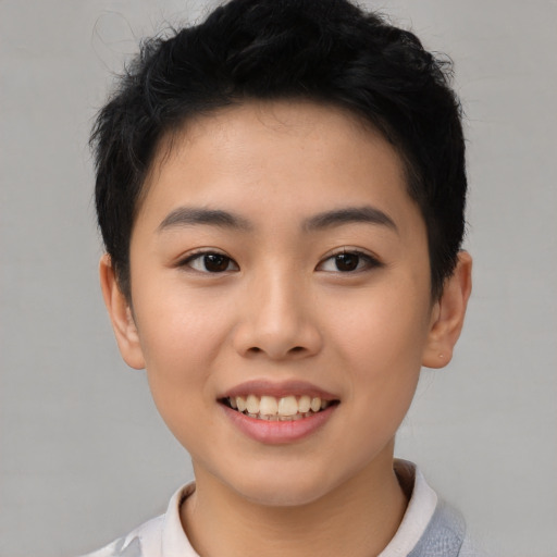 Joyful asian young-adult female with short  black hair and brown eyes