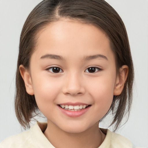 Joyful white child female with medium  brown hair and brown eyes