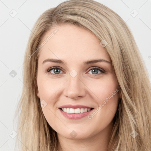 Joyful white young-adult female with long  brown hair and green eyes