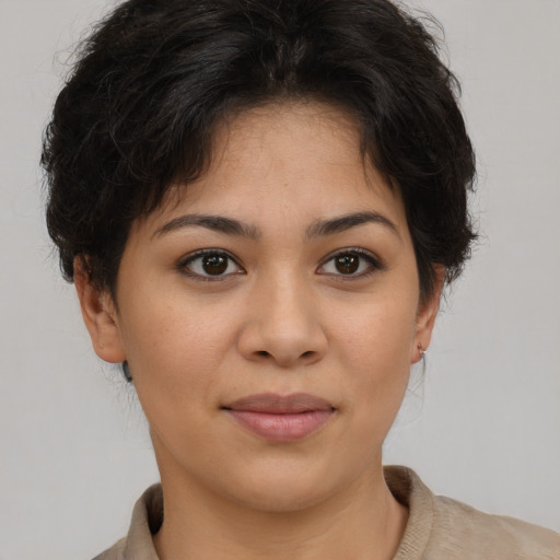 Joyful asian young-adult female with short  brown hair and brown eyes