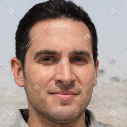 Joyful white adult male with short  brown hair and brown eyes