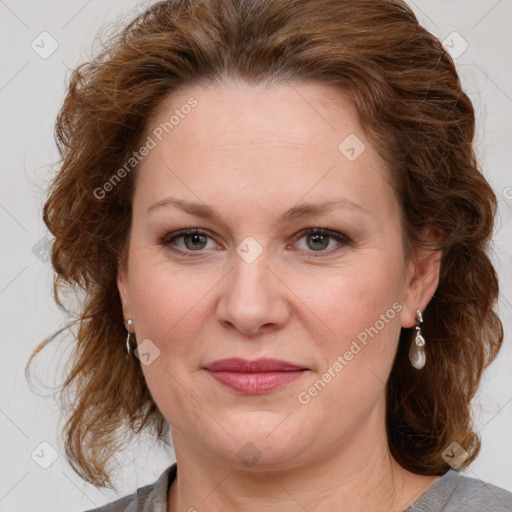 Joyful white adult female with medium  brown hair and blue eyes