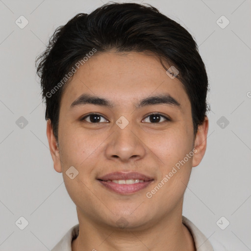 Joyful asian young-adult male with short  brown hair and brown eyes