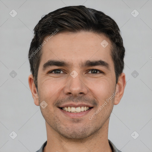 Joyful white young-adult male with short  brown hair and brown eyes