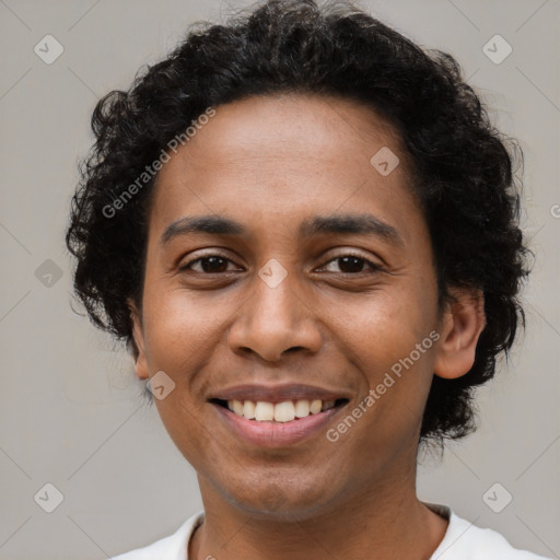 Joyful latino young-adult male with short  brown hair and brown eyes