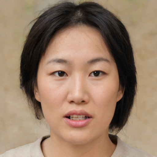 Neutral asian young-adult female with medium  brown hair and brown eyes
