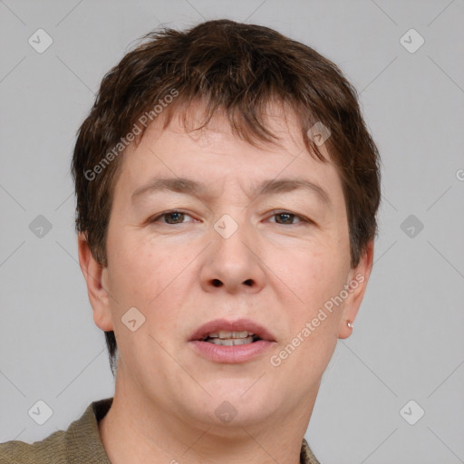 Joyful white adult male with short  brown hair and grey eyes