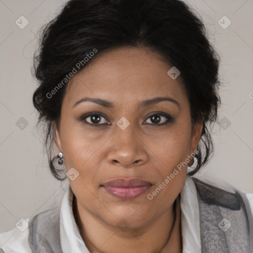 Joyful black adult female with medium  brown hair and brown eyes