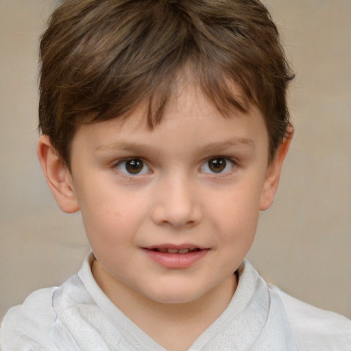 Joyful white child male with short  brown hair and brown eyes