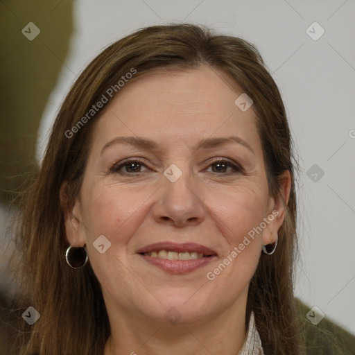 Joyful white adult female with long  brown hair and grey eyes