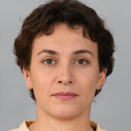 Neutral white young-adult female with short  brown hair and brown eyes