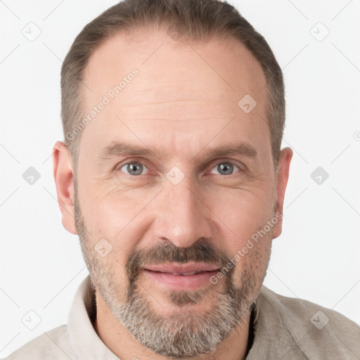 Joyful white adult male with short  brown hair and grey eyes