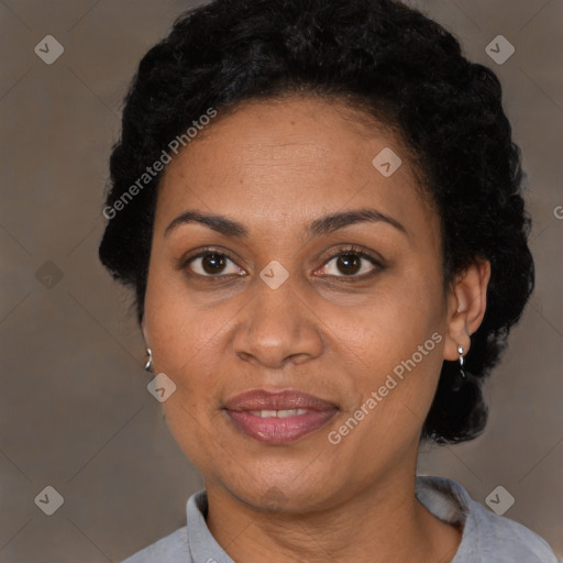 Joyful black adult female with short  brown hair and brown eyes