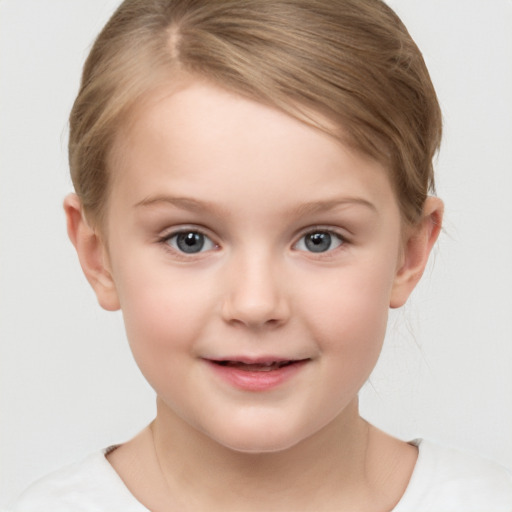 Joyful white child female with short  brown hair and grey eyes