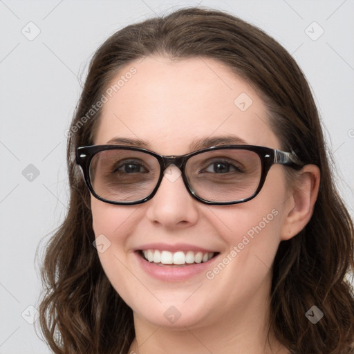 Joyful white young-adult female with long  brown hair and blue eyes