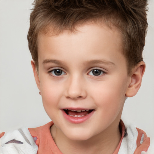 Joyful white child male with short  brown hair and brown eyes