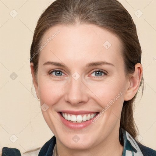 Joyful white young-adult female with medium  brown hair and grey eyes