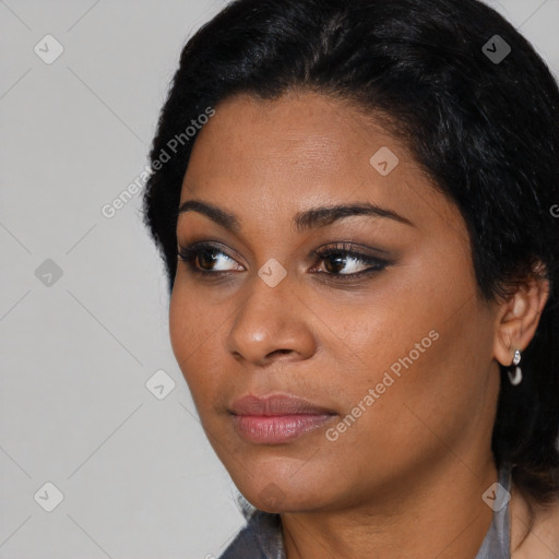 Joyful latino young-adult female with short  black hair and brown eyes