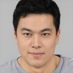 Neutral asian young-adult male with short  brown hair and brown eyes