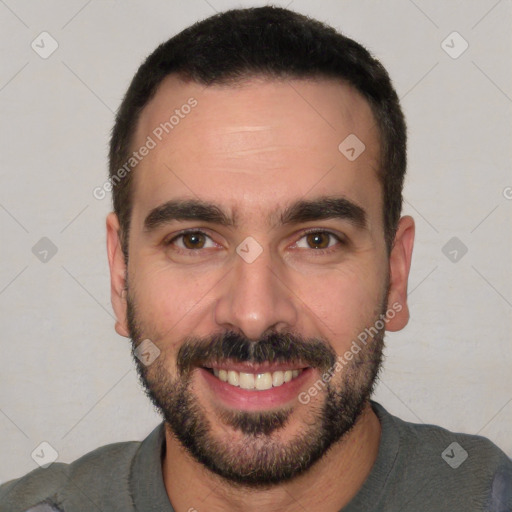 Joyful white young-adult male with short  black hair and brown eyes