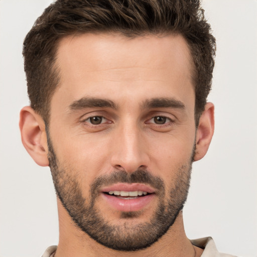 Joyful white young-adult male with short  brown hair and brown eyes