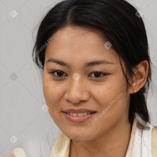 Joyful asian young-adult female with long  brown hair and brown eyes