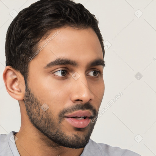 Neutral latino young-adult male with short  black hair and brown eyes