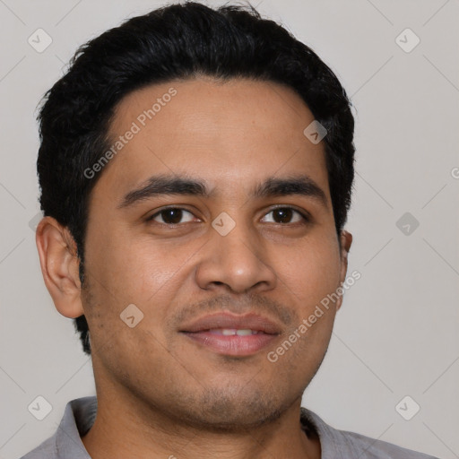 Joyful latino young-adult male with short  black hair and brown eyes