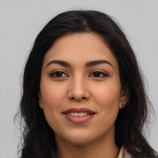 Joyful asian young-adult female with long  brown hair and brown eyes