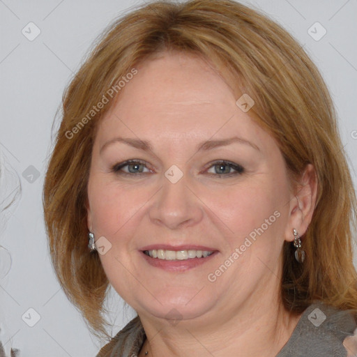 Joyful white adult female with medium  brown hair and blue eyes