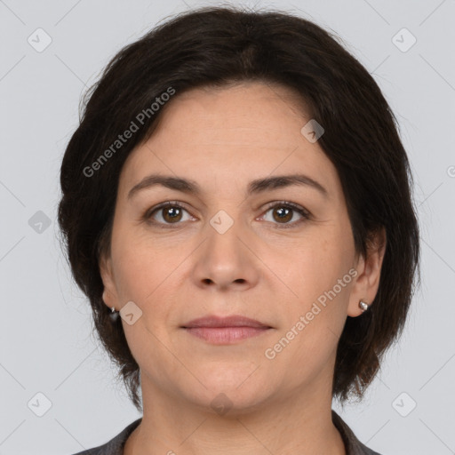 Joyful white adult female with medium  brown hair and brown eyes