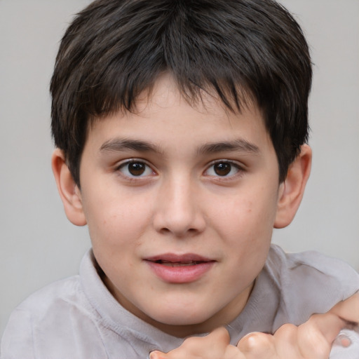 Joyful white child male with short  brown hair and brown eyes