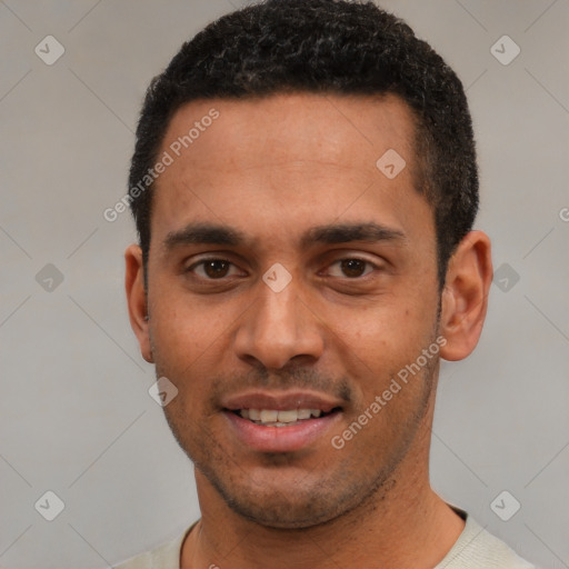 Joyful white young-adult male with short  black hair and brown eyes