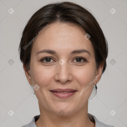 Joyful white adult female with medium  brown hair and brown eyes