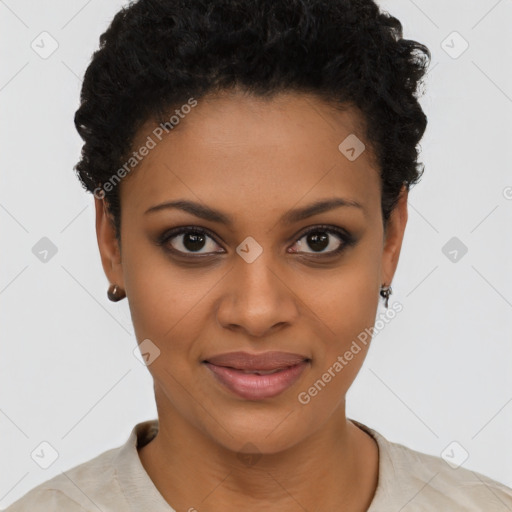 Joyful black young-adult female with short  black hair and brown eyes