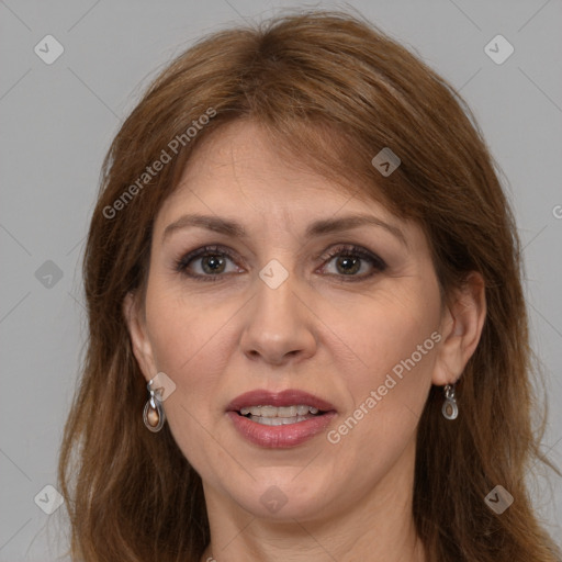 Joyful white adult female with long  brown hair and brown eyes