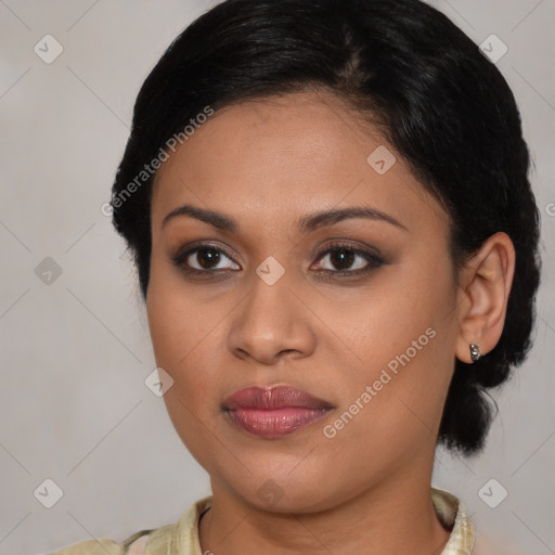 Joyful latino young-adult female with medium  brown hair and brown eyes