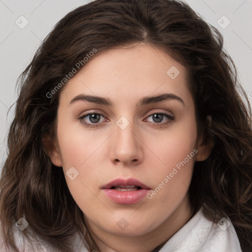 Neutral white young-adult female with long  brown hair and brown eyes