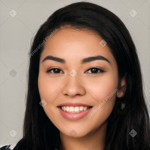 Joyful latino young-adult female with long  black hair and brown eyes