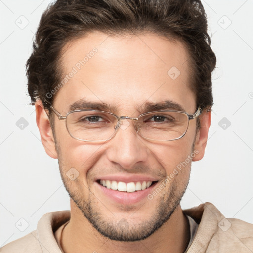 Joyful white adult male with short  brown hair and brown eyes