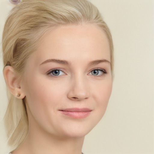 Joyful white young-adult female with medium  brown hair and blue eyes