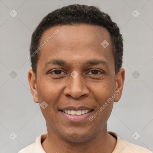 Joyful latino young-adult male with short  brown hair and brown eyes