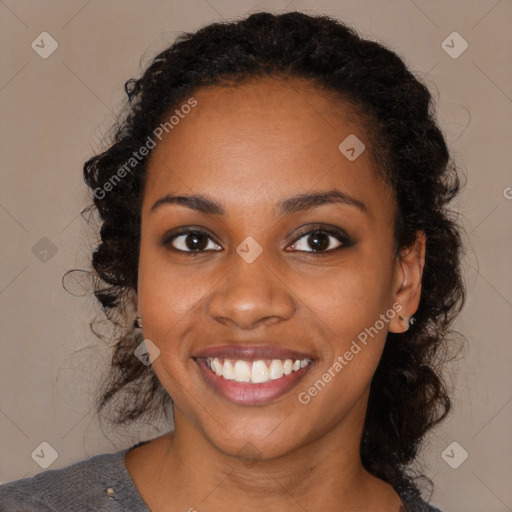 Joyful black young-adult female with medium  brown hair and brown eyes