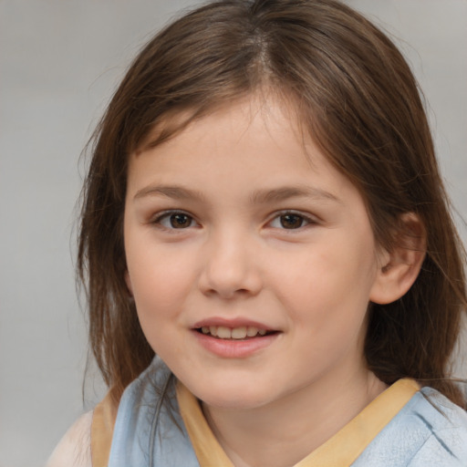 Joyful white child female with medium  brown hair and brown eyes