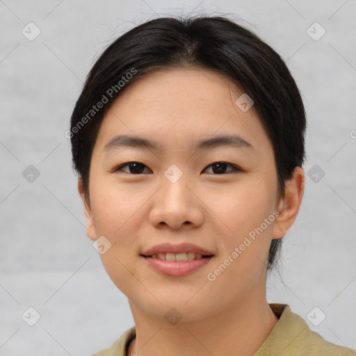 Joyful asian young-adult female with short  brown hair and brown eyes