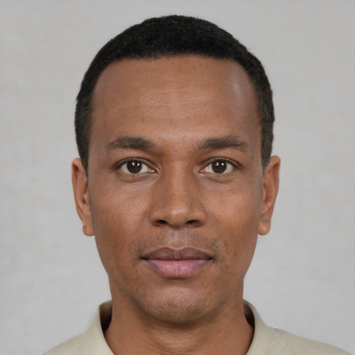 Neutral black young-adult male with short  black hair and brown eyes